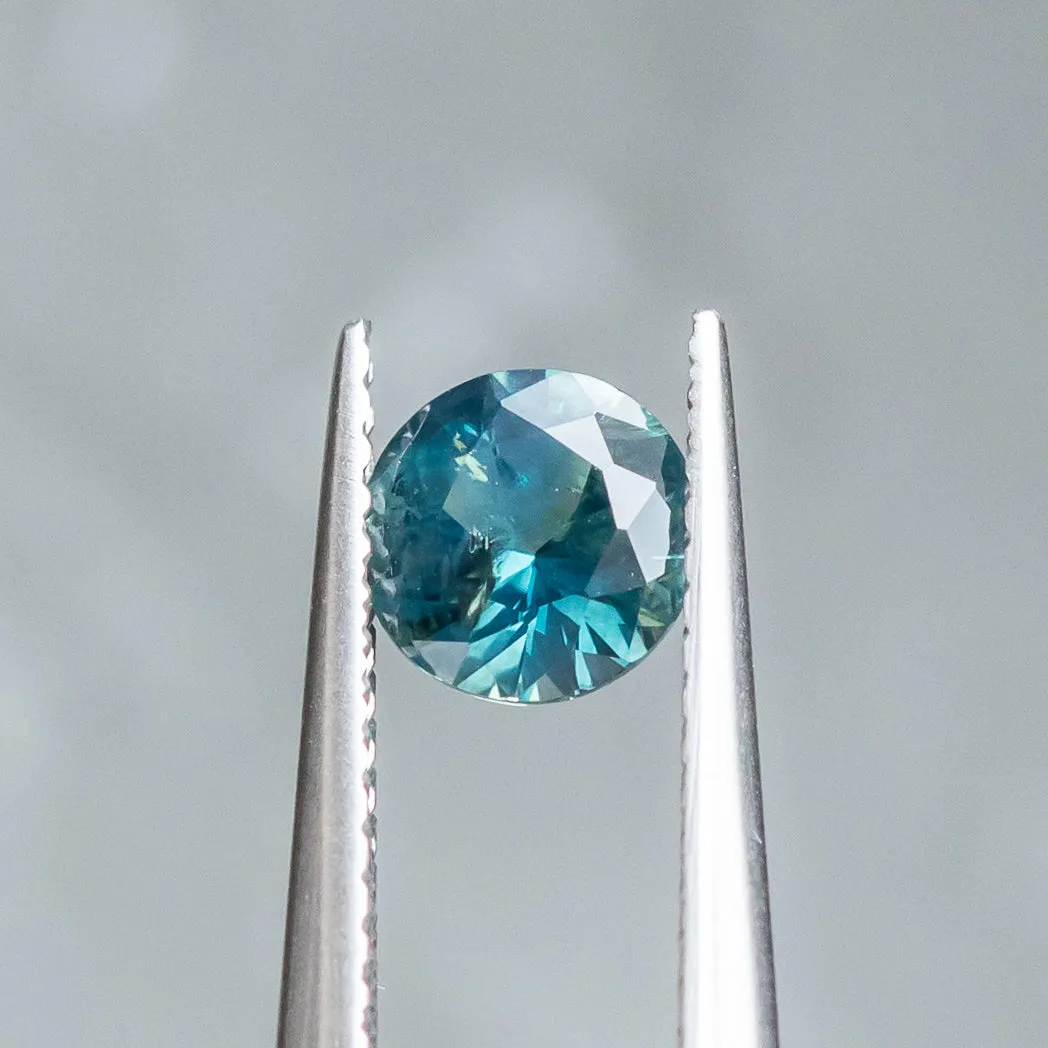 0.95CT ROUND BRILLIANT NIGERIAN SAPPHIRE, PARTI TEAL GREEN, 5.92X3.56MM, UNTREATED