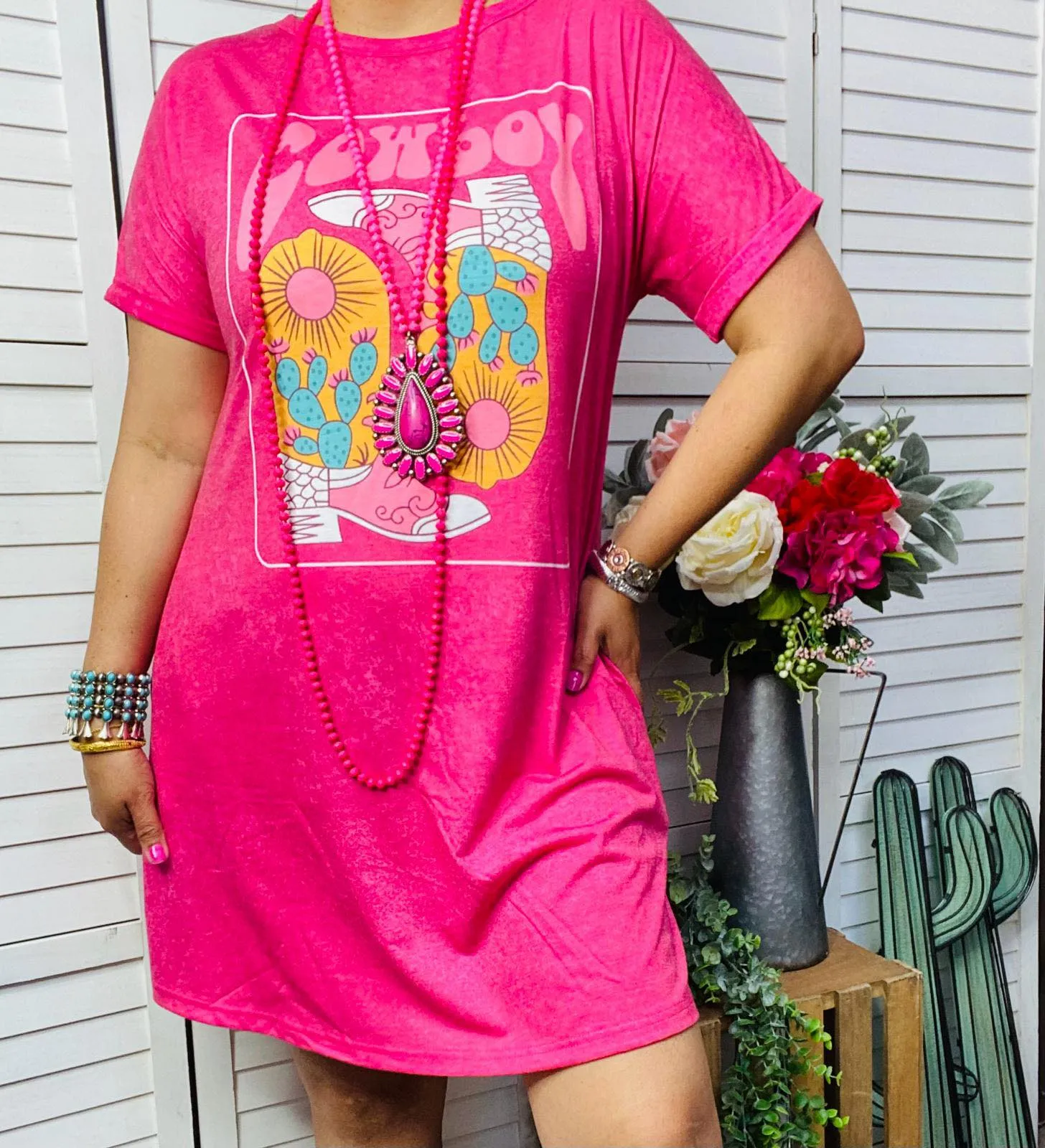 Pink T-shirt dress with cowboy boot graphic